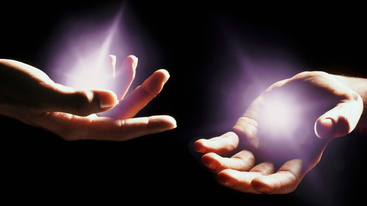Hands with light emminating from them